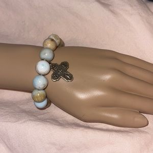 Heavy beaded bracelet with cross charm
